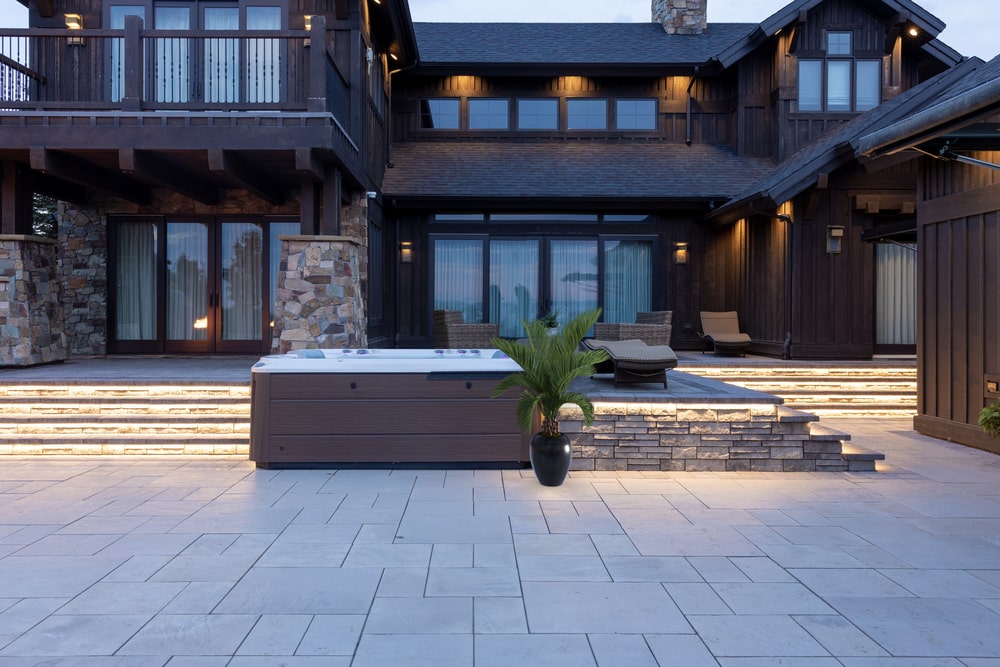 Backyard Hot Tub in Front of Spacious House